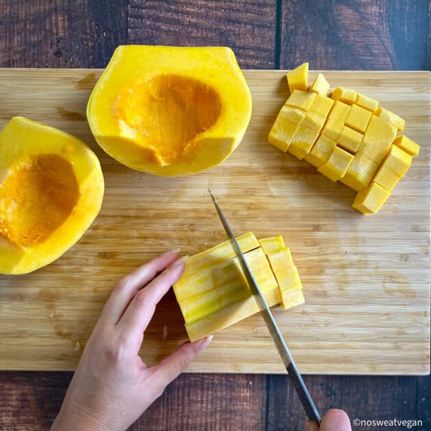 Butternut squash cubed on cutting board.
