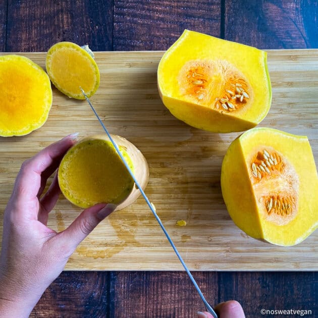 Hand trimming butternut squash.