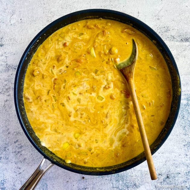Add coconut milk to the curry.