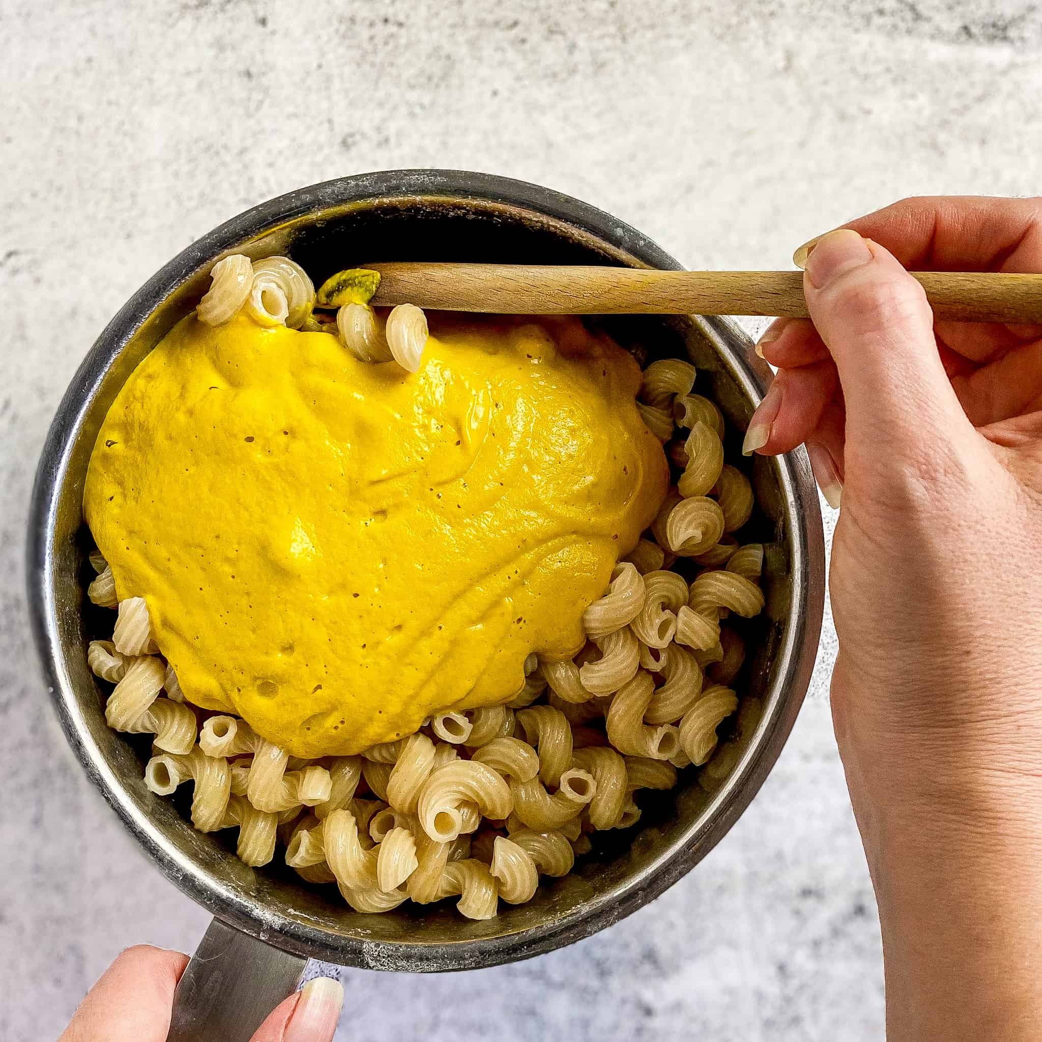 Vegan pumpkin cheese sauce added to pasta.