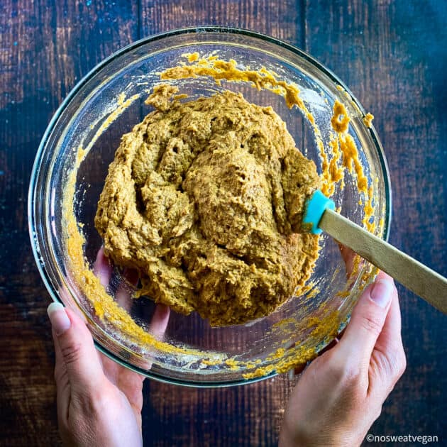 Mixed batter for vegan pumpkin muffins.
