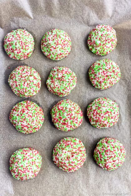 Baked vegan Christmas cookies on baking sheet.