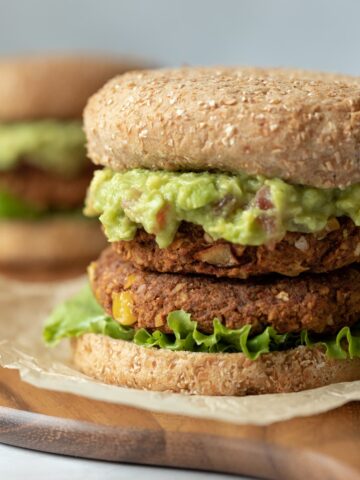 Tex-Mex chickpea burgers on cutting board.