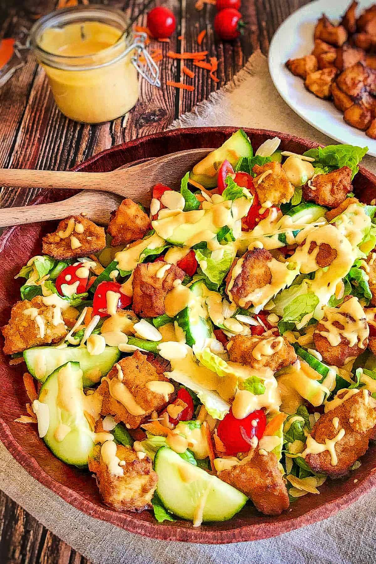 Vegan honey mustard dressing on salad.