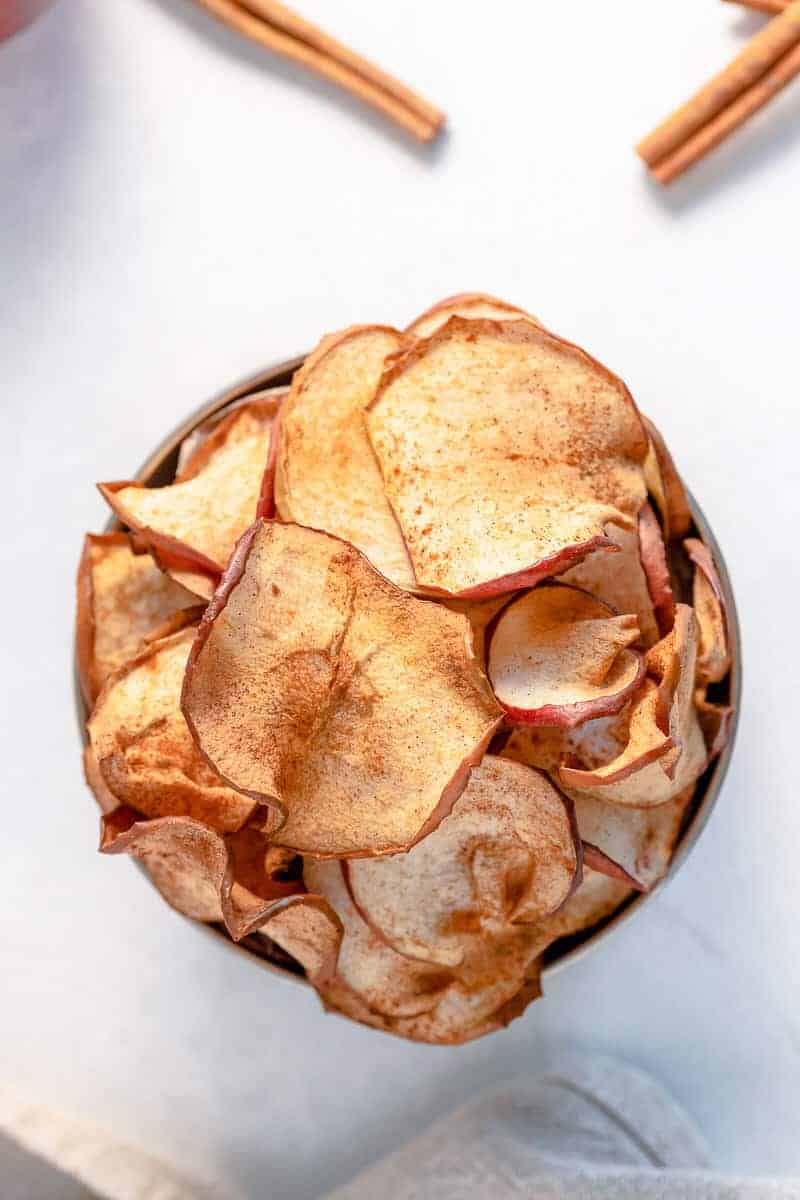 Air Fryer apple chips in bowl.