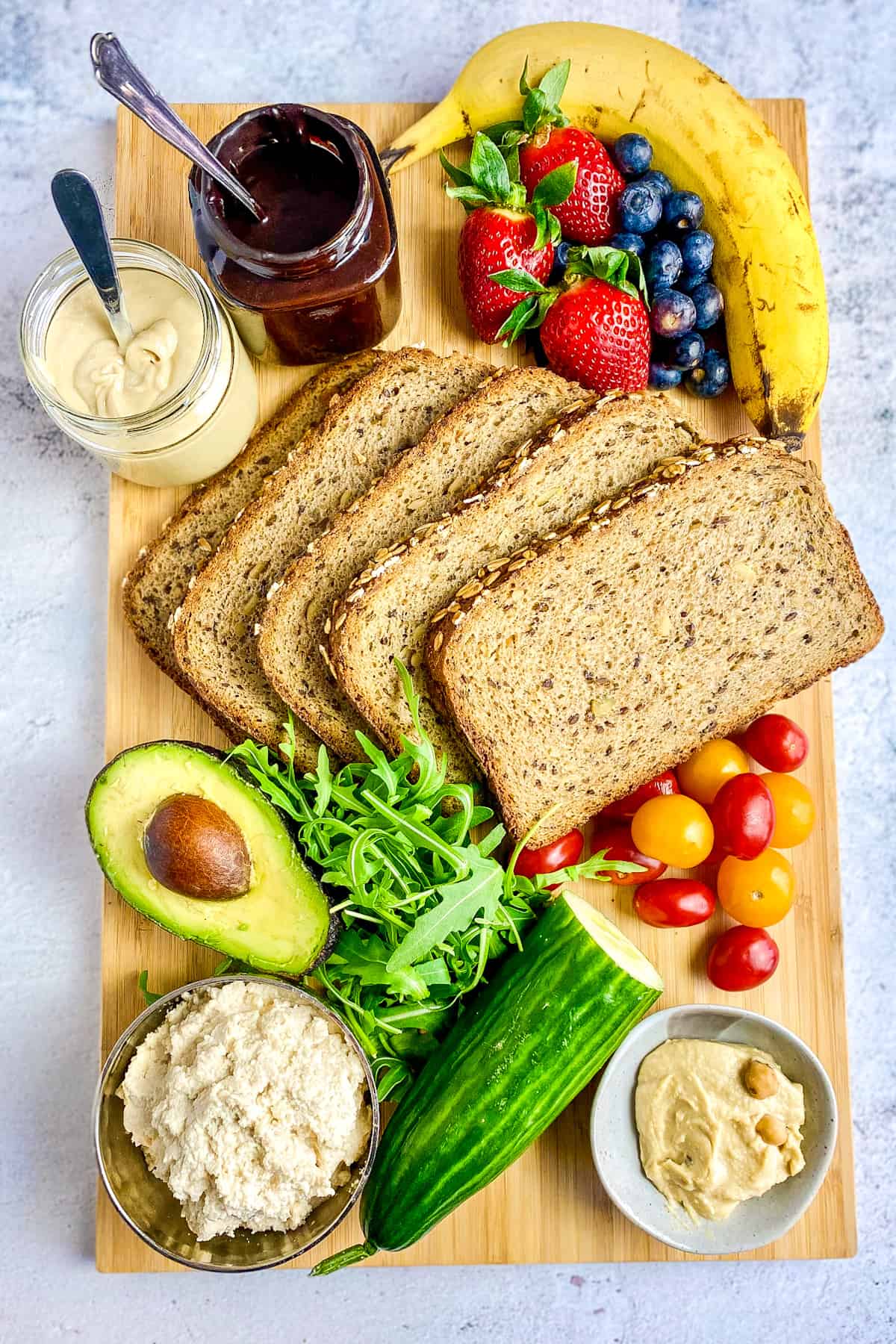 Vegan toast topping ideas on a cutting board.