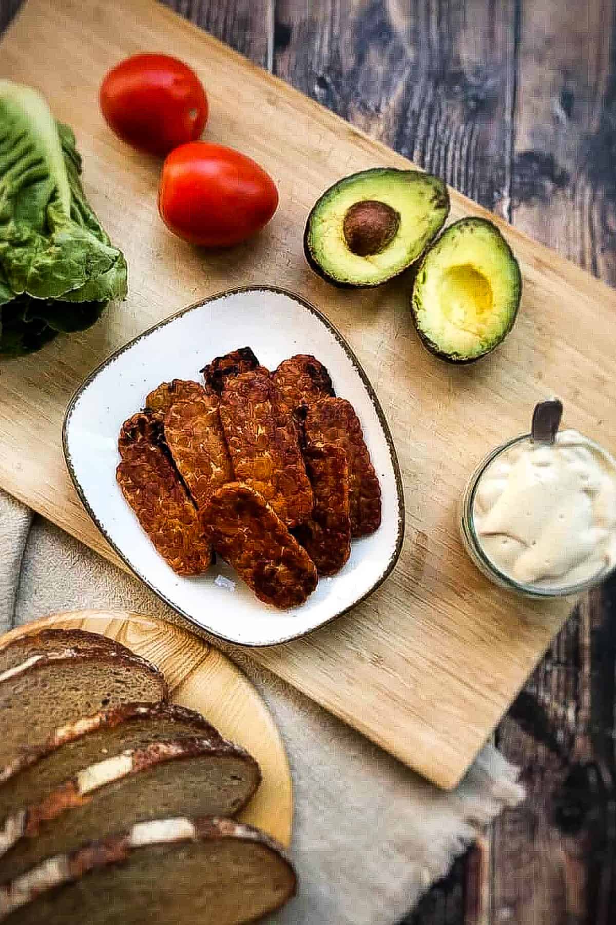 Vegan BLT ingredients on a cutting board.