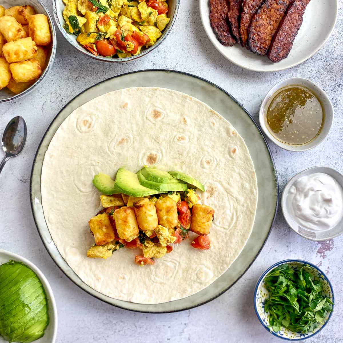Avoacdo and tater tots added to burrito.