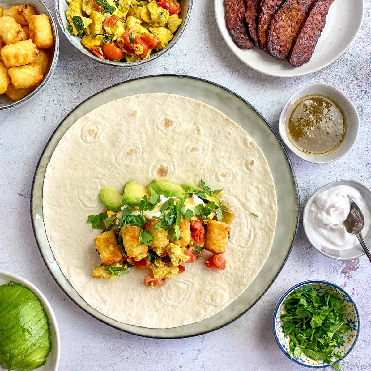 Vegan sour cream, salsa, and cilantro added to burrito.