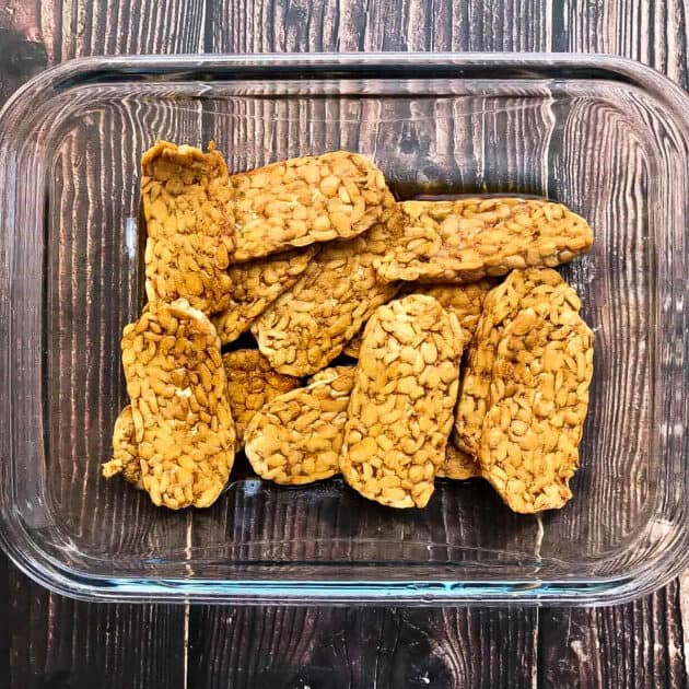 Tempeh in marinade for vegan bacon.