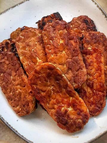 Tempeh bacon on plate.