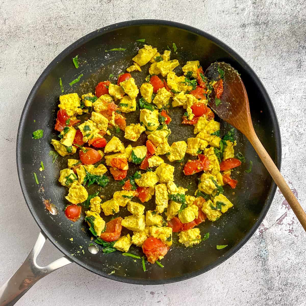 Breakfast burrito tofu scramble in a skillet.