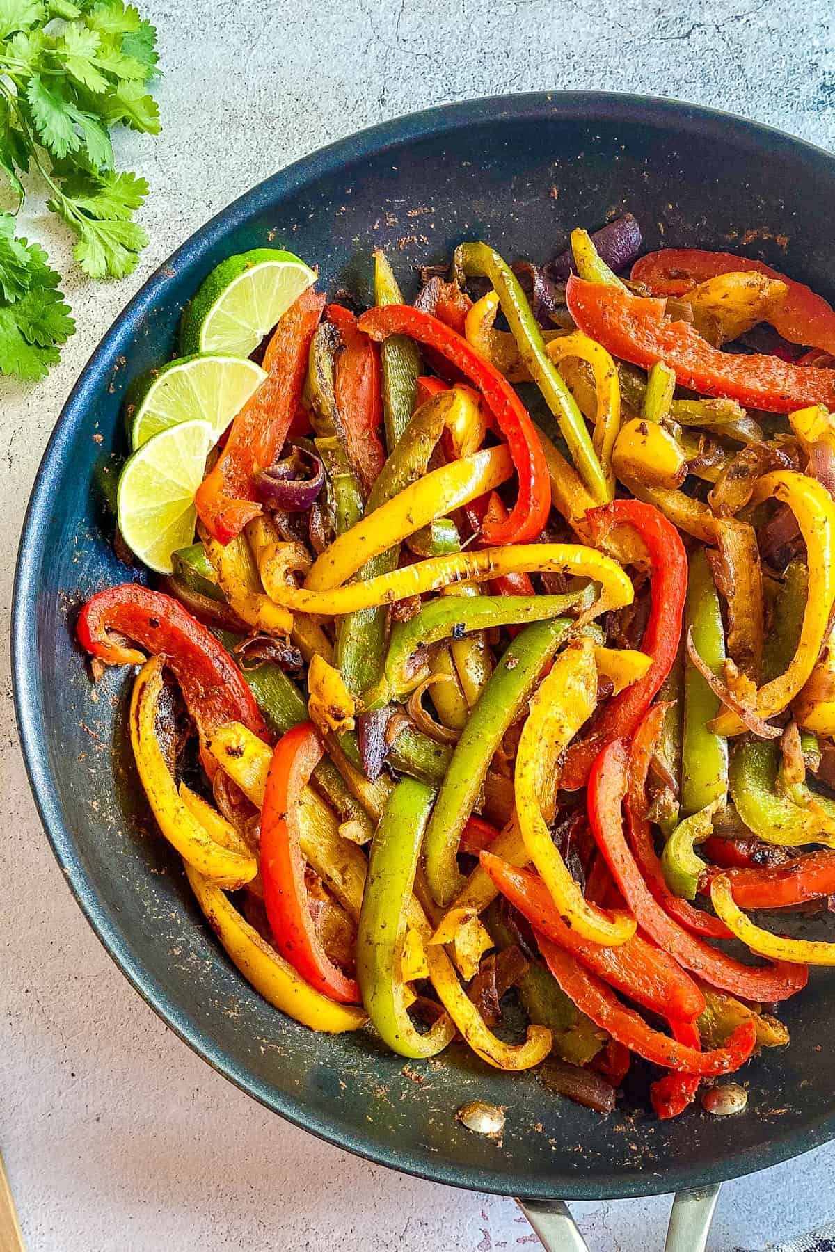 Fajita veggies in skillet.