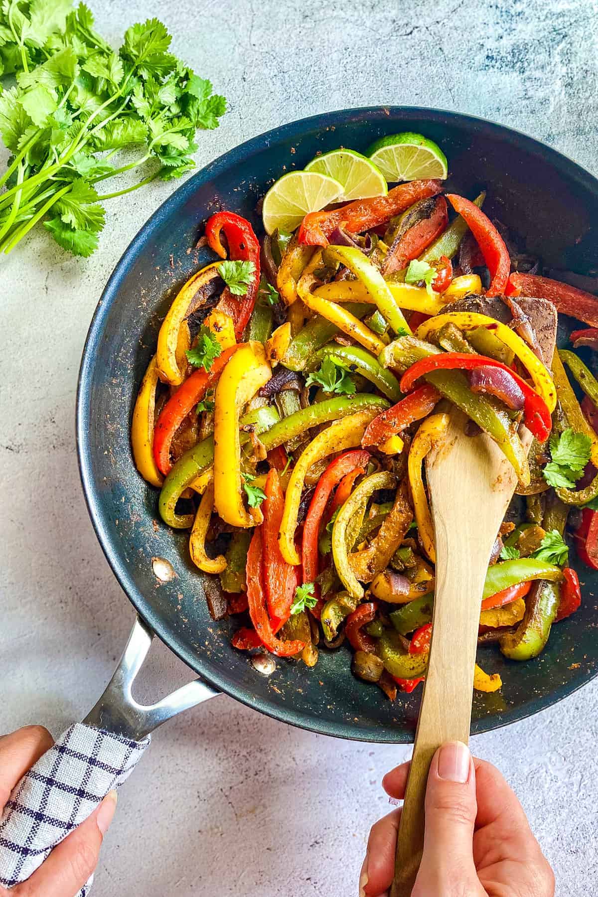 Fajita veggies in a skillet.