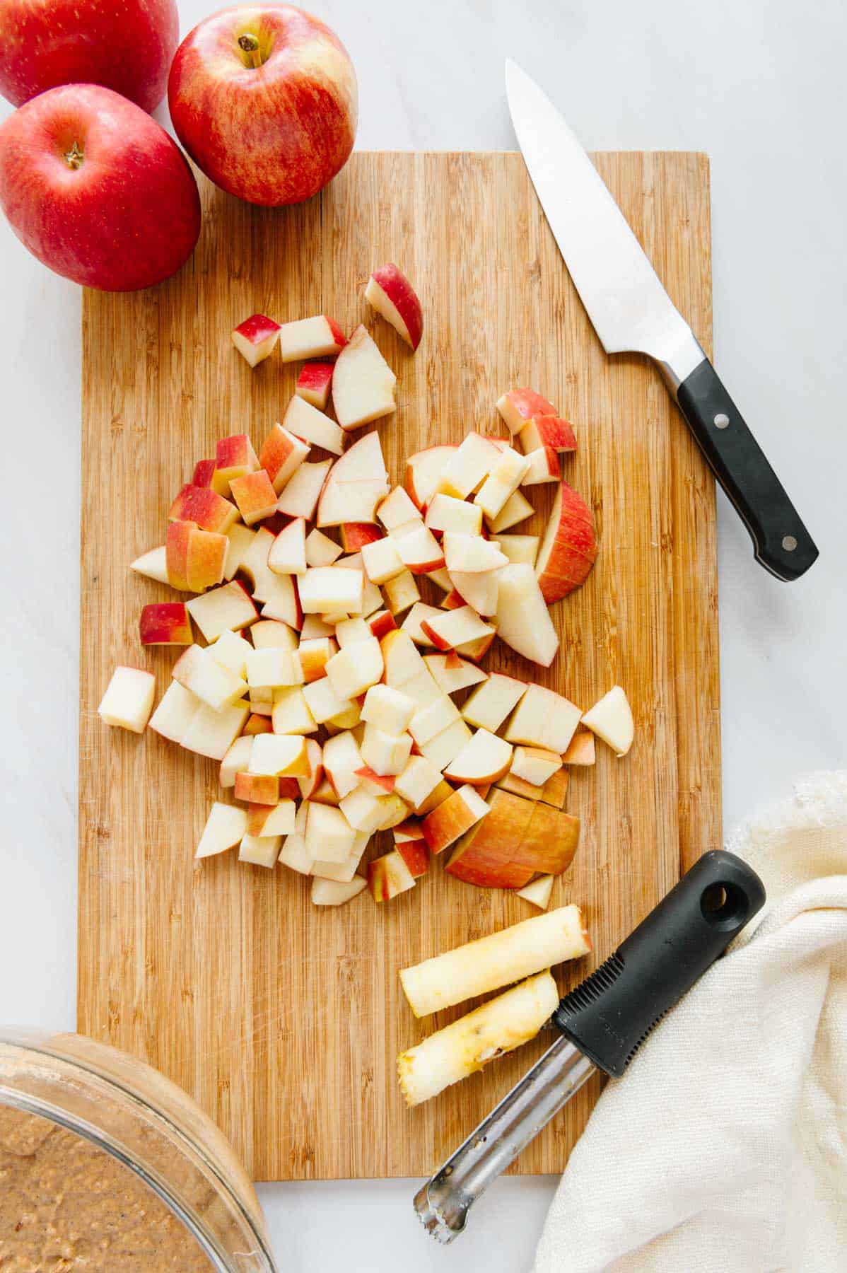 Chopped apples on a cutting board.