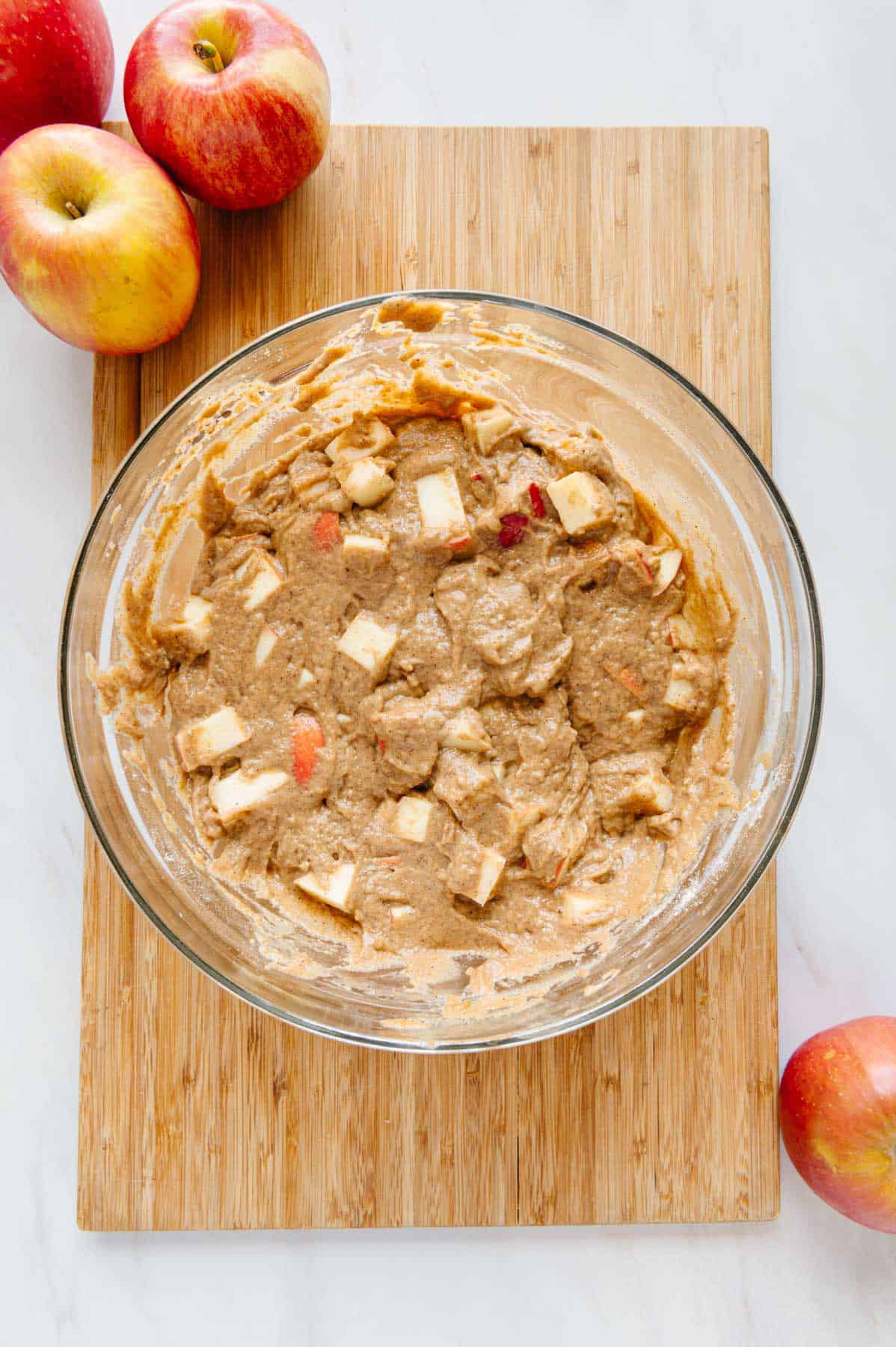 Apple muffin batter in a bowl.