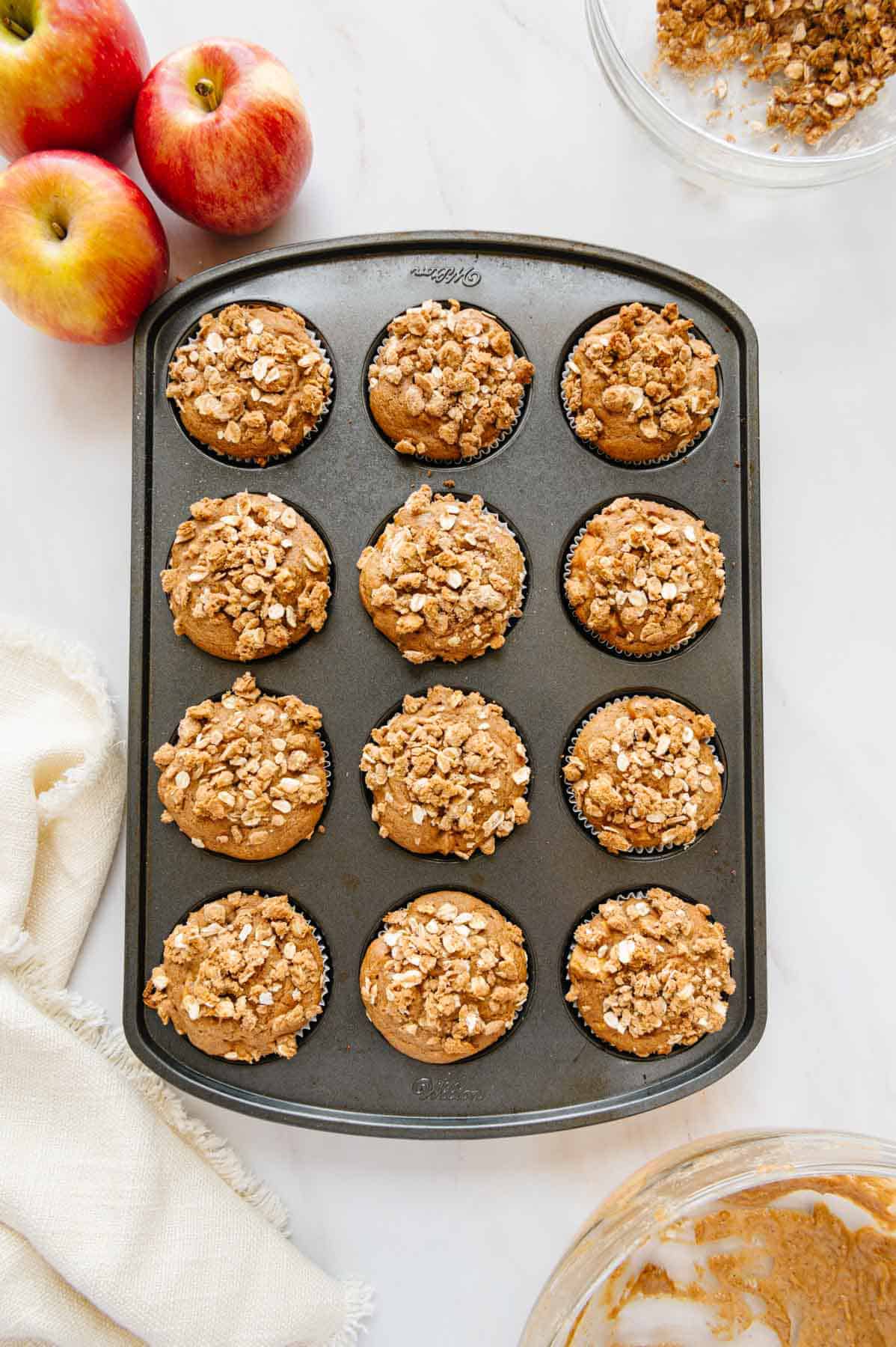 Cooked vegan apple muffins in form.
