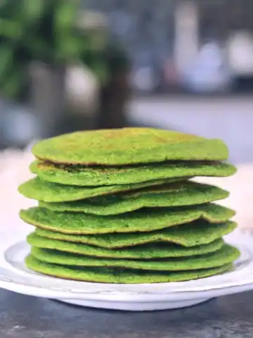 Vegan spinach pancakes on a plate.