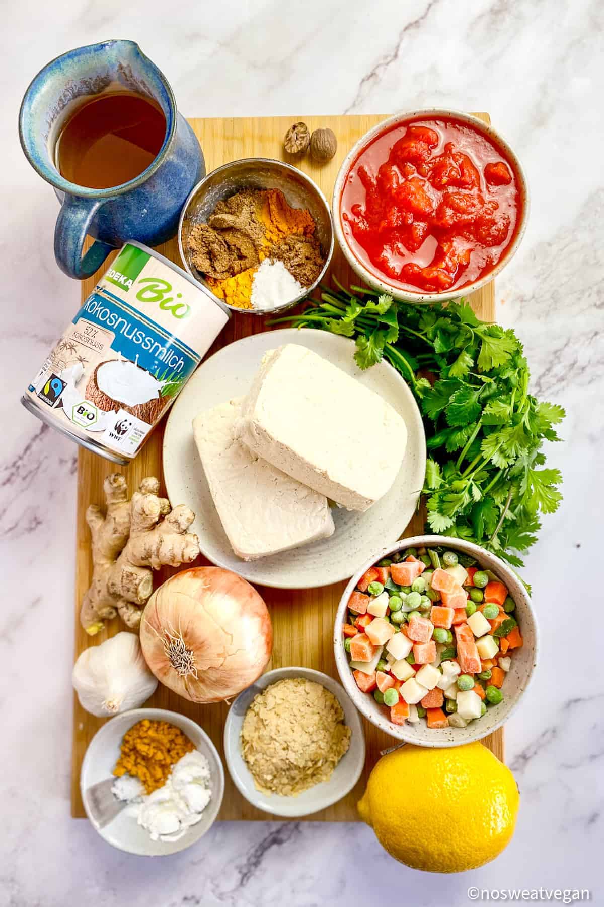 Ingredients for Tofu Curry on a cutting board.