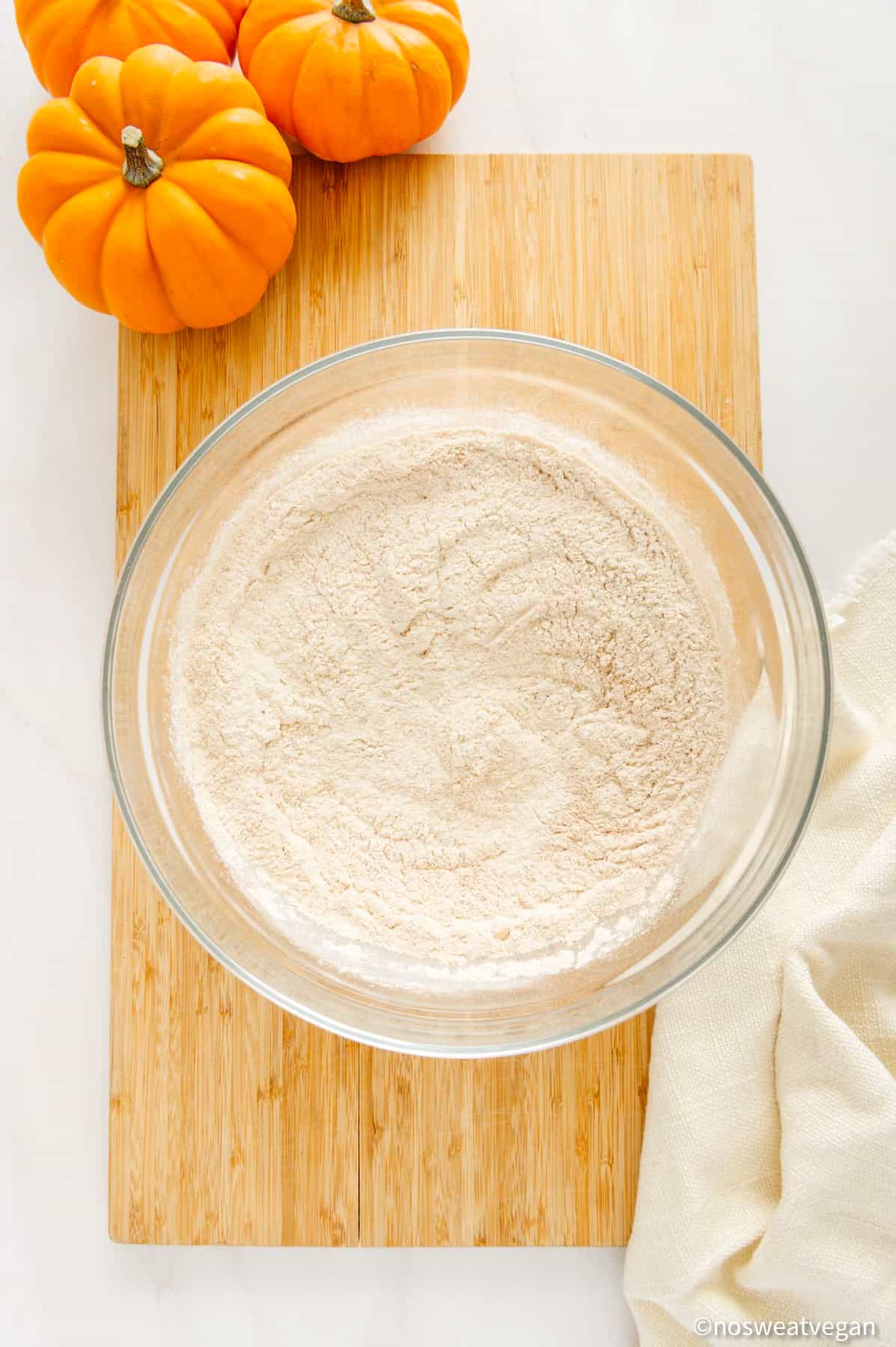 Whole wheat pumpkin pancakes dry ingredients in a bowl.