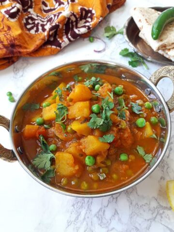 Instant Pot Aloo Matar in a bowl.