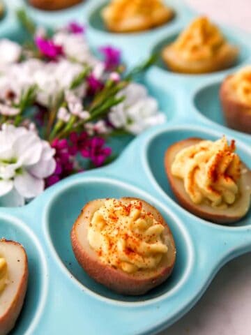 Deviled potatoes on a tray.