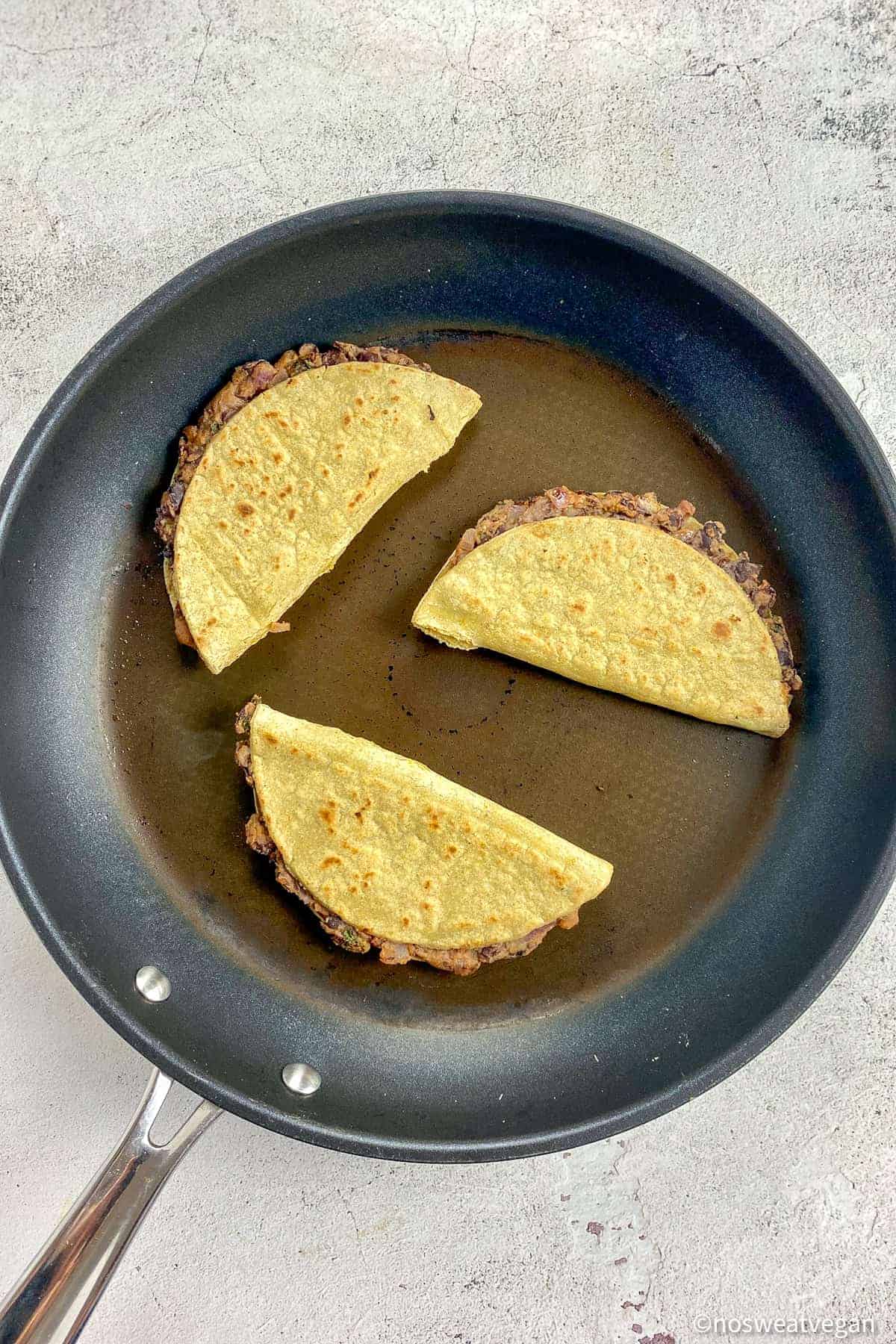 Vegan black bean tacos in a skillet.