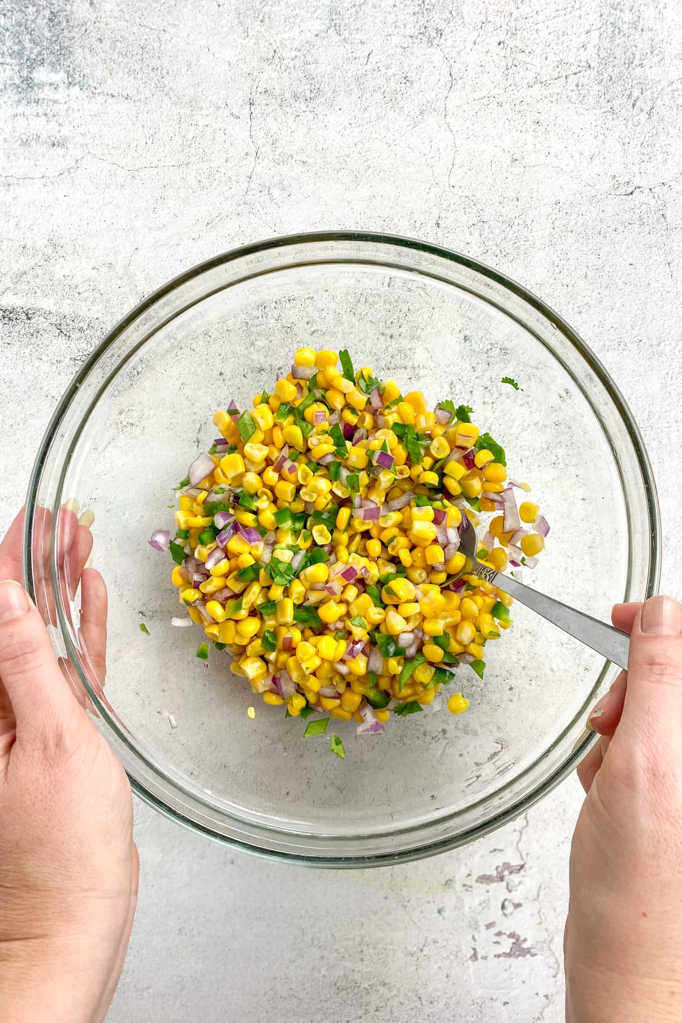 Corn salsa mixed in a bowl.