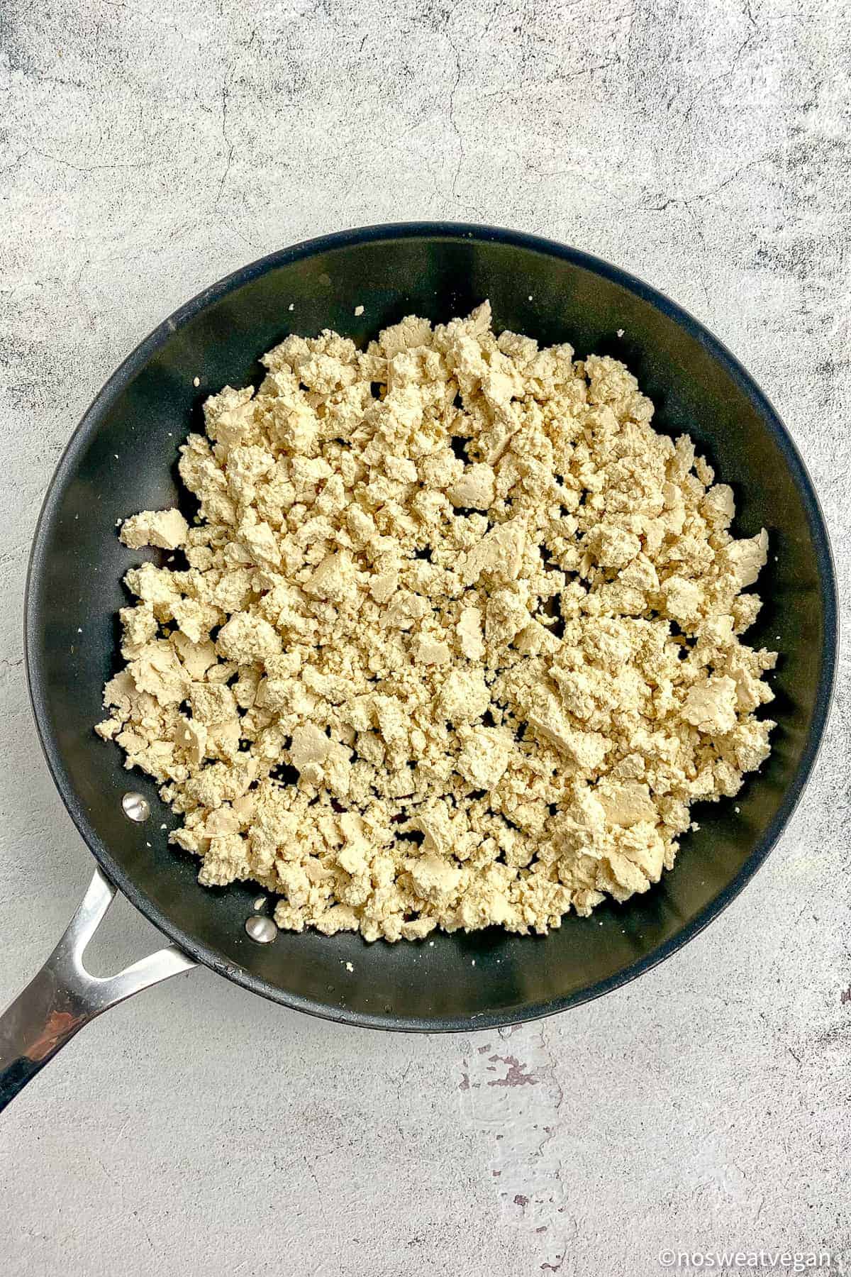 Sofritas tofu crumbled in a skillet.