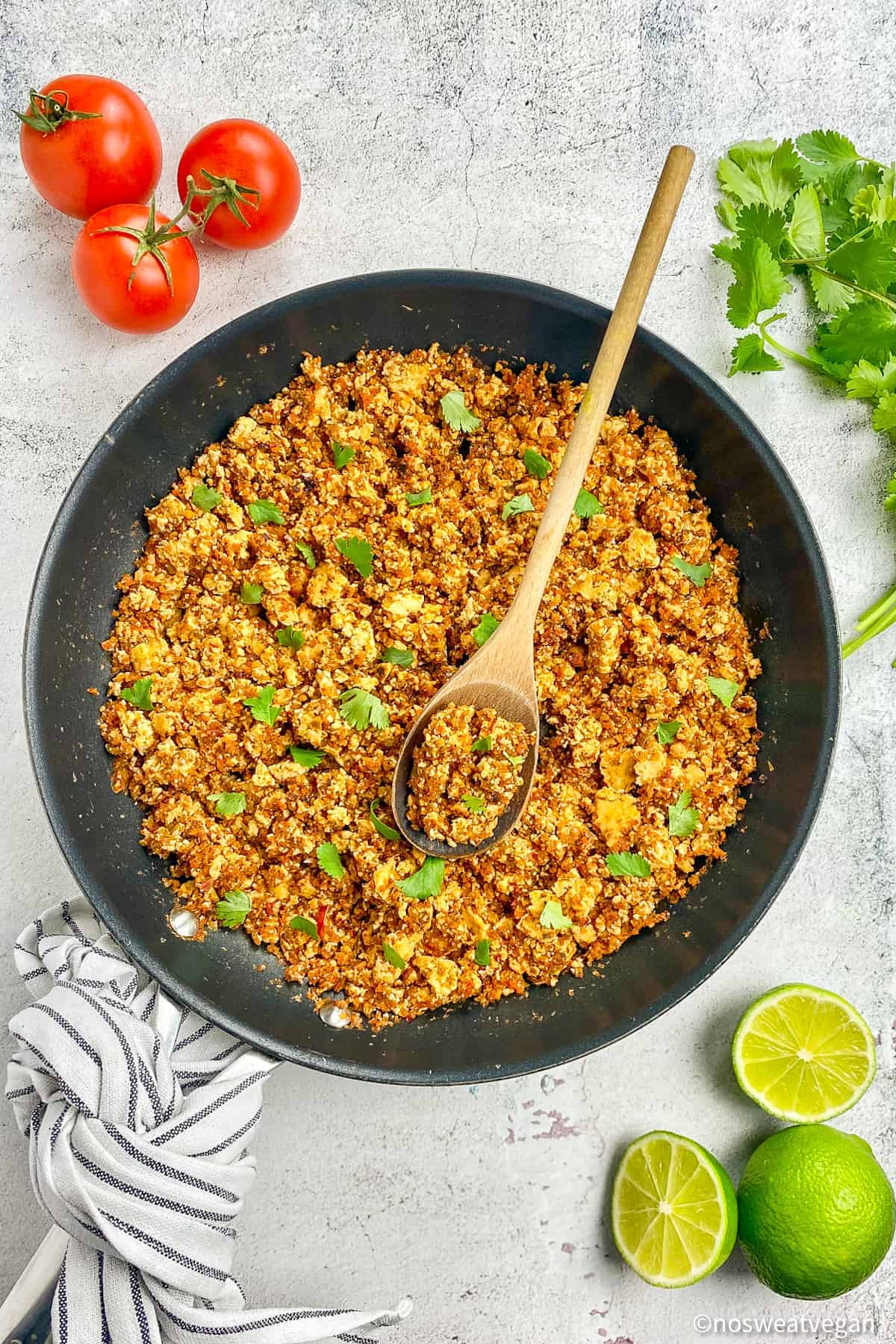 Sofritas in a skillet with a spoon.