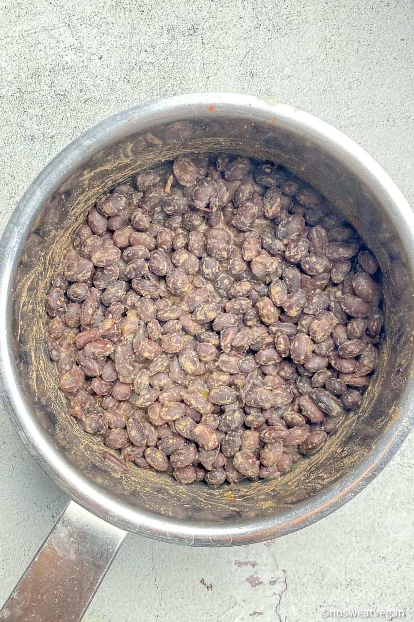 Chipotle-style black beans in a pot.