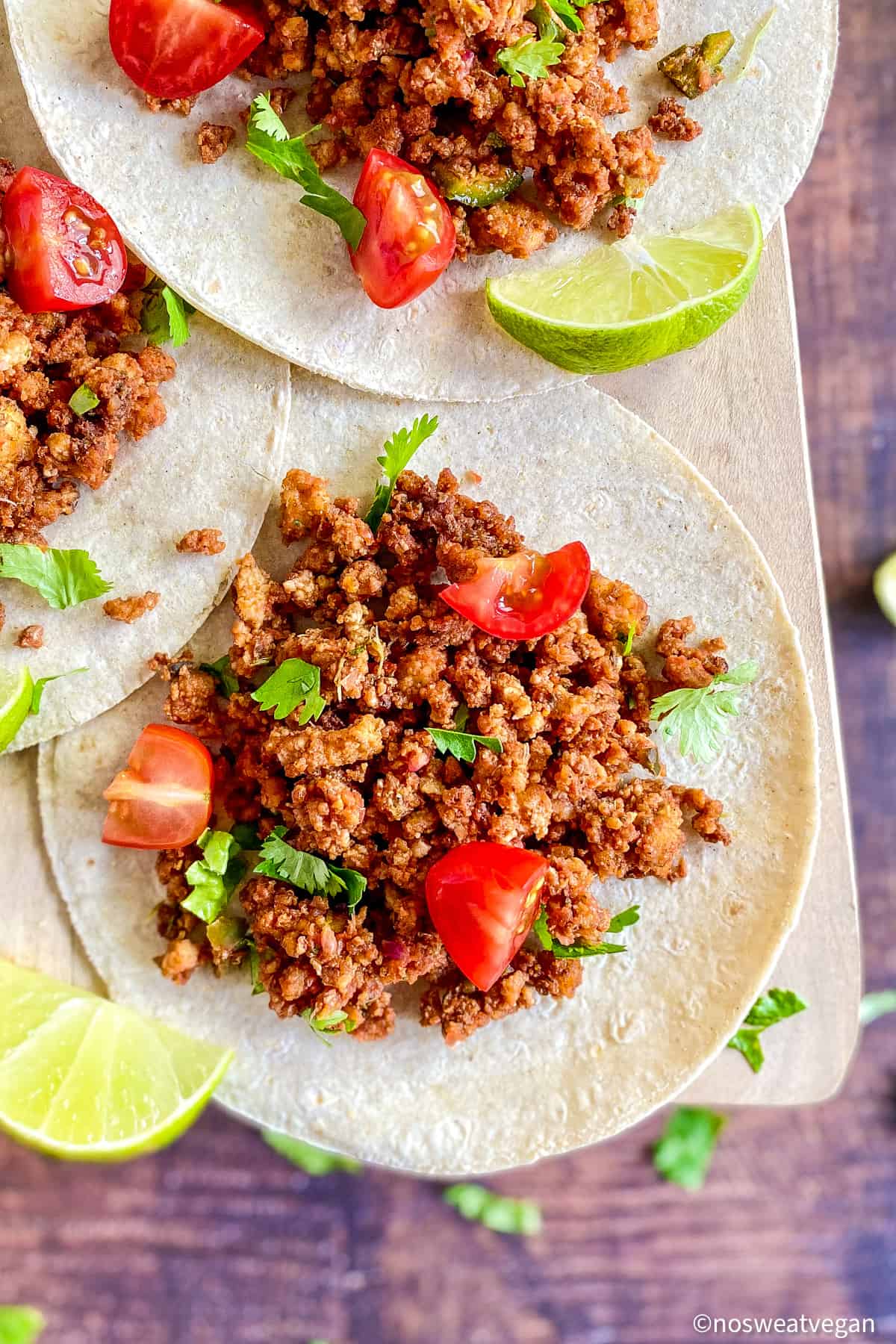 Tofu tacos on a board.
