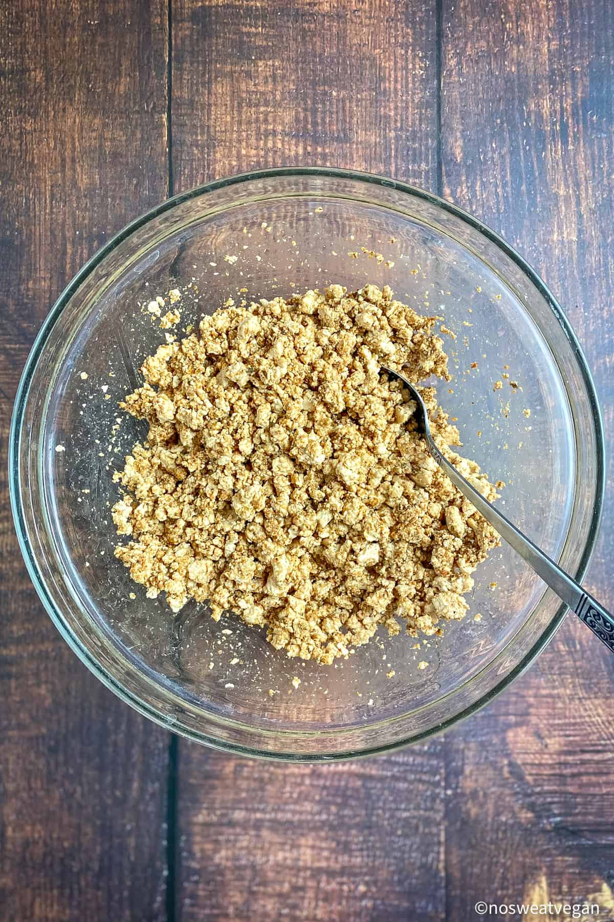 Tofu crumbles mixed with paste.