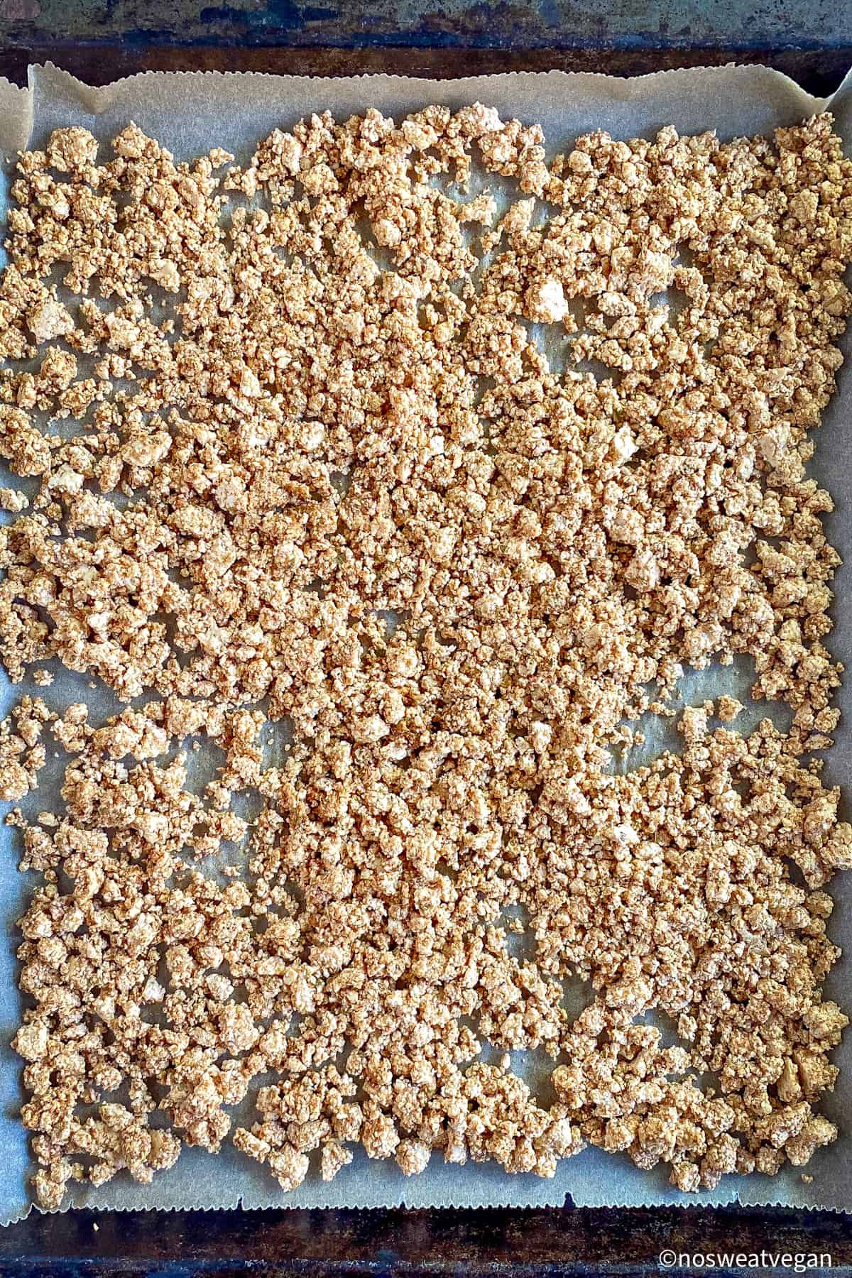 Vegan tofu taco meat uncooked on a sheet tray.