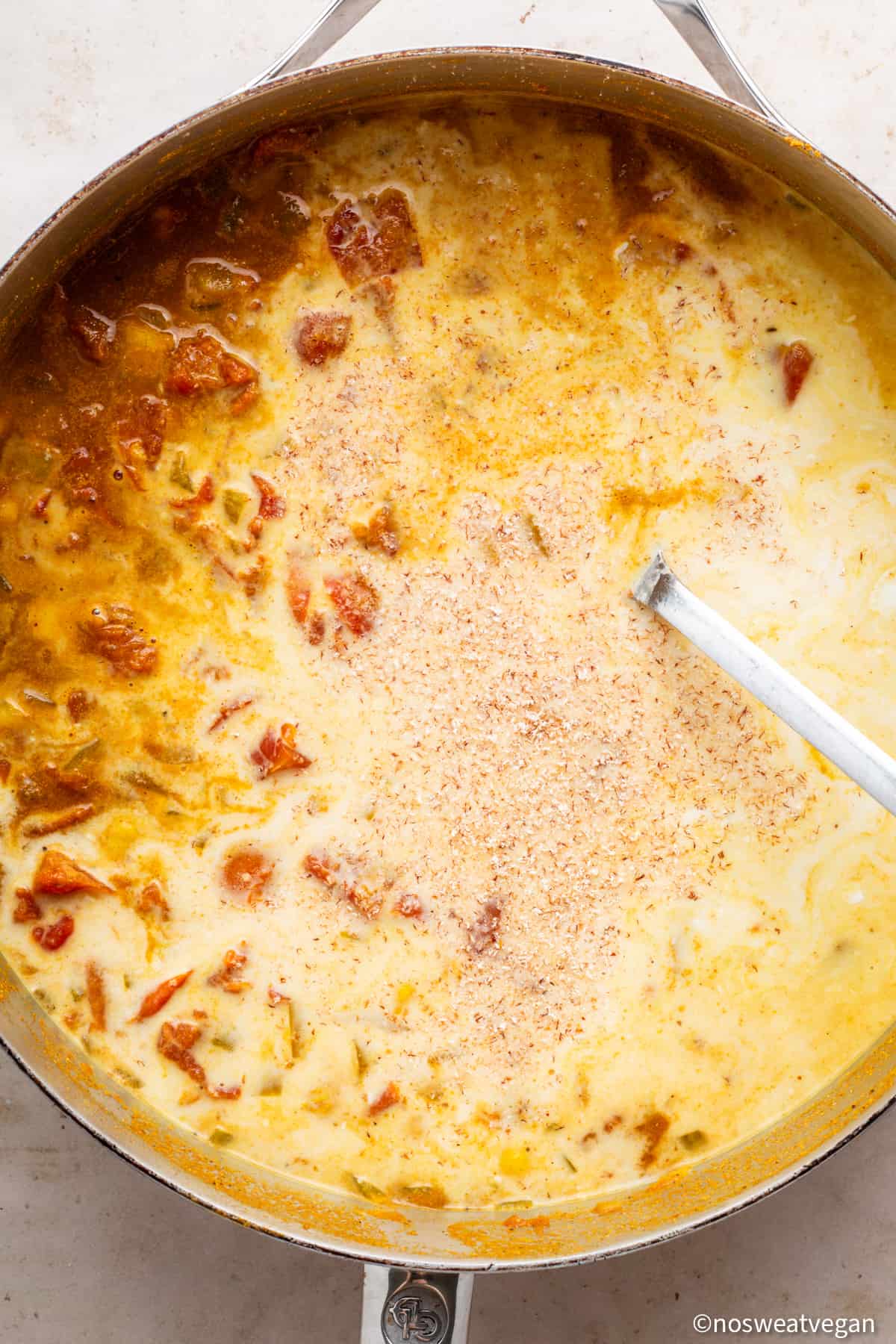 Coconut milk and nutmeg added to the curry.
