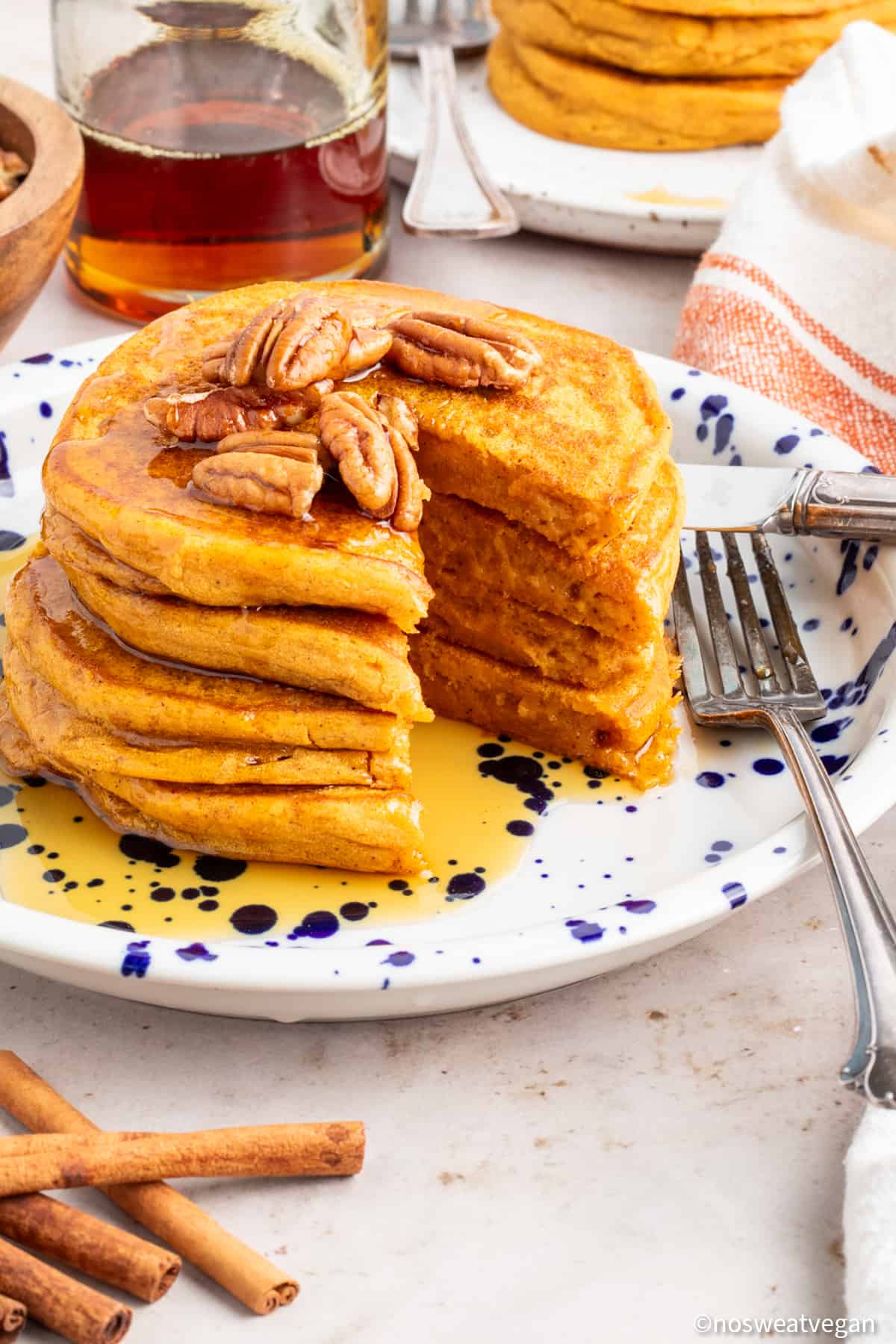 Vegan sweet potatoes stacked on a plate.