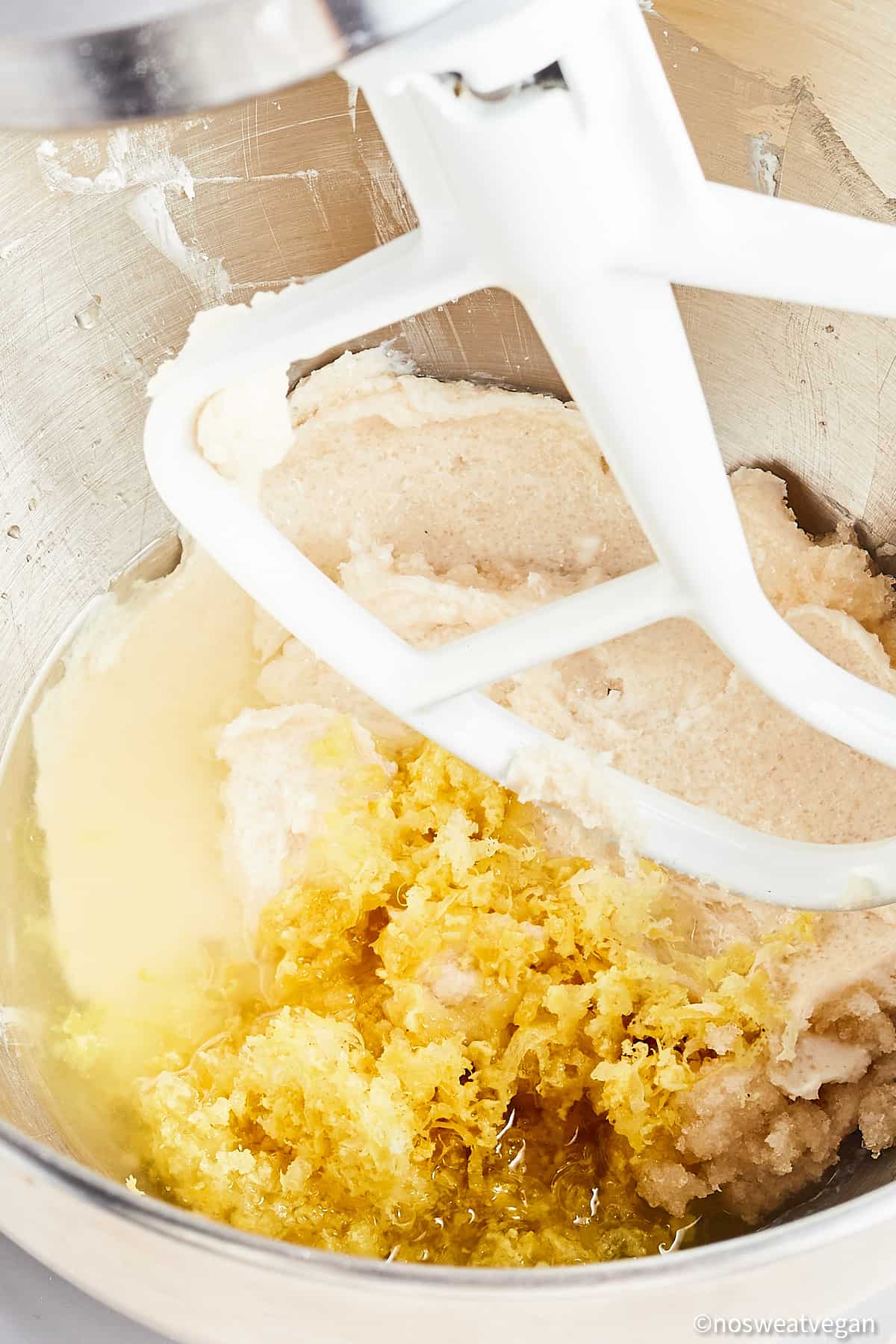 Add lemon juice and zest to the vegan lemon cookie dough.