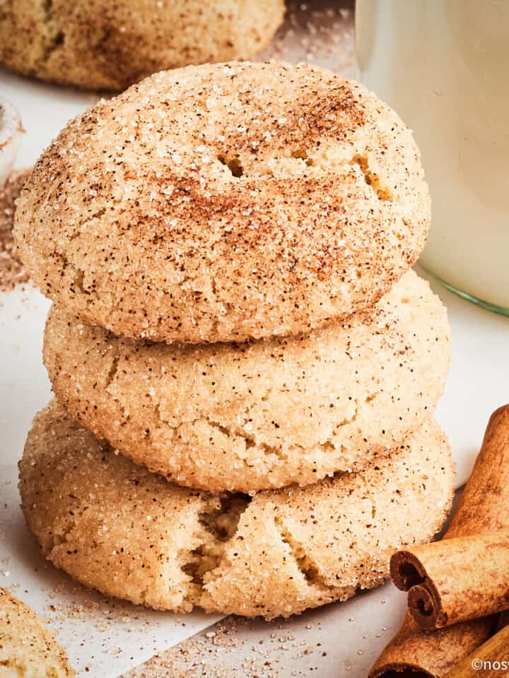 Vegan snickerdoodles stacked.