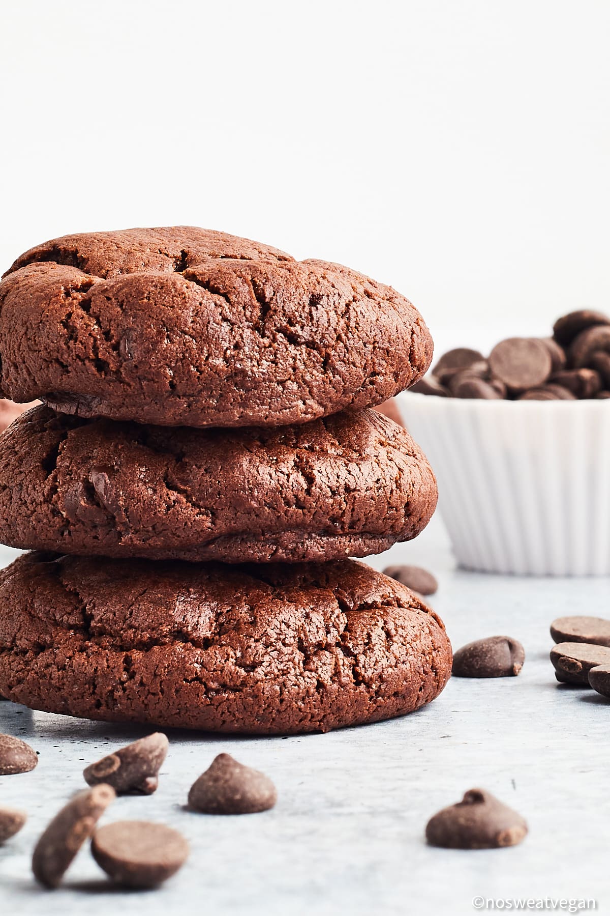 Stack of vegan chocolate chocolate chip cookies.
