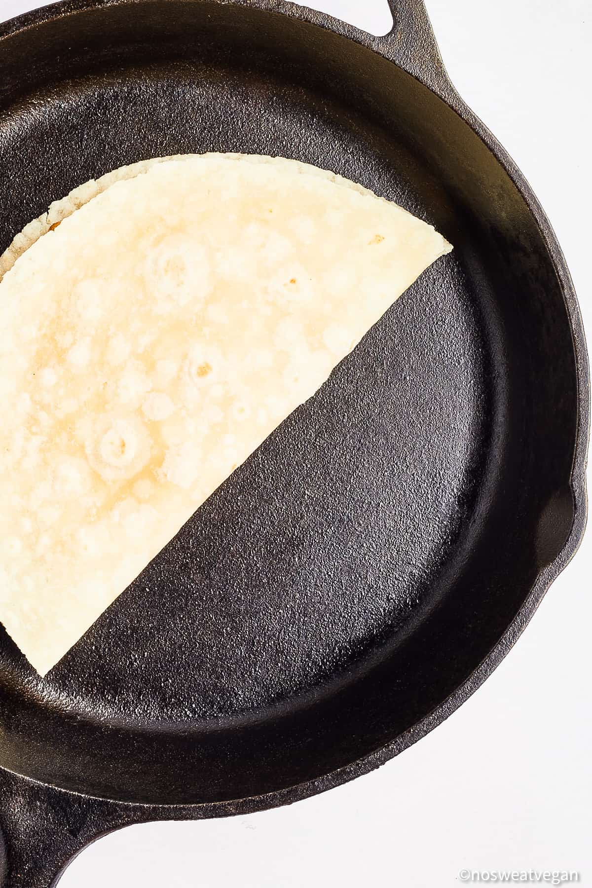 Vegan quesadilla in a skillet.