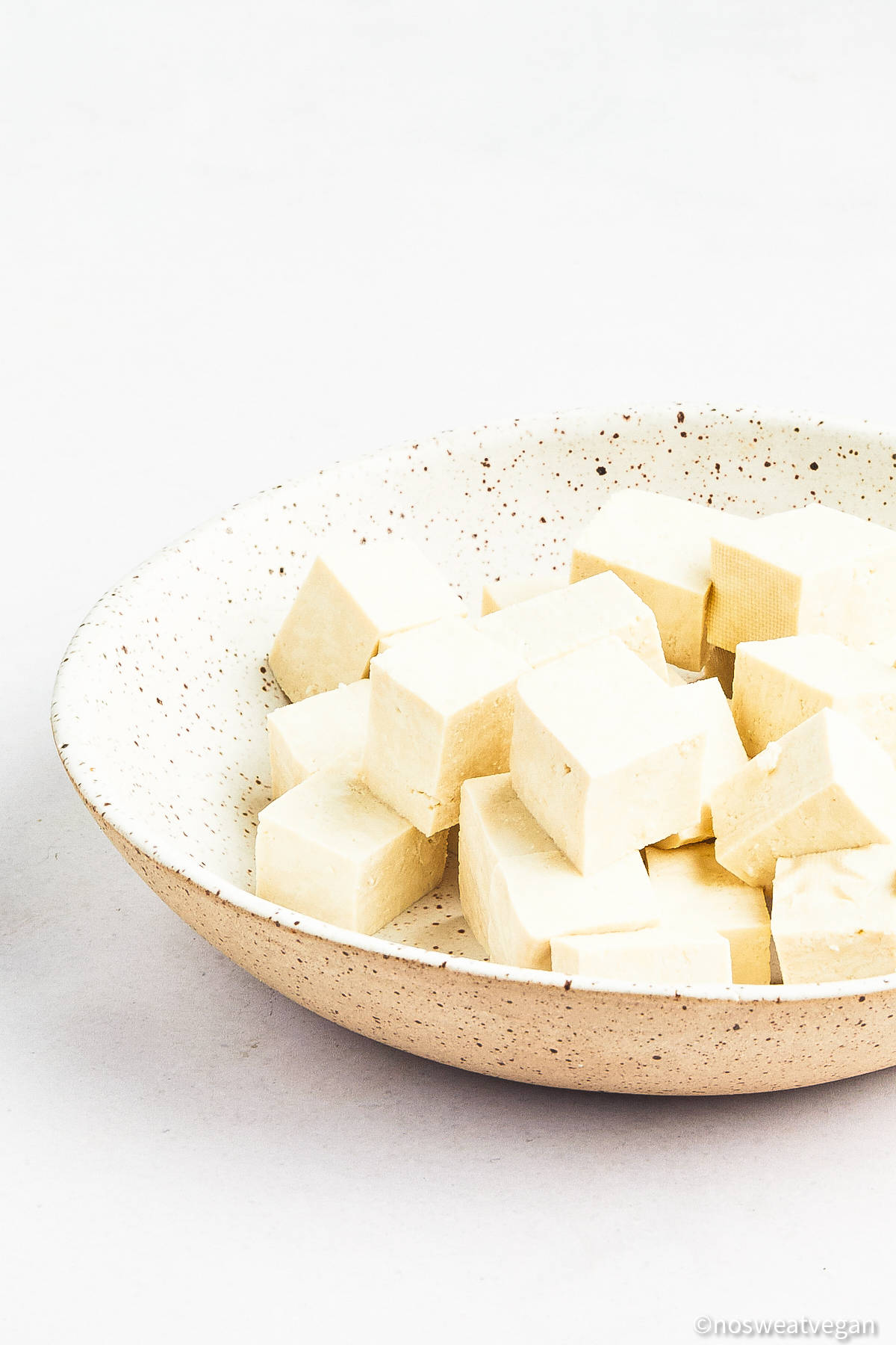 Tofu cubes in a bowl.