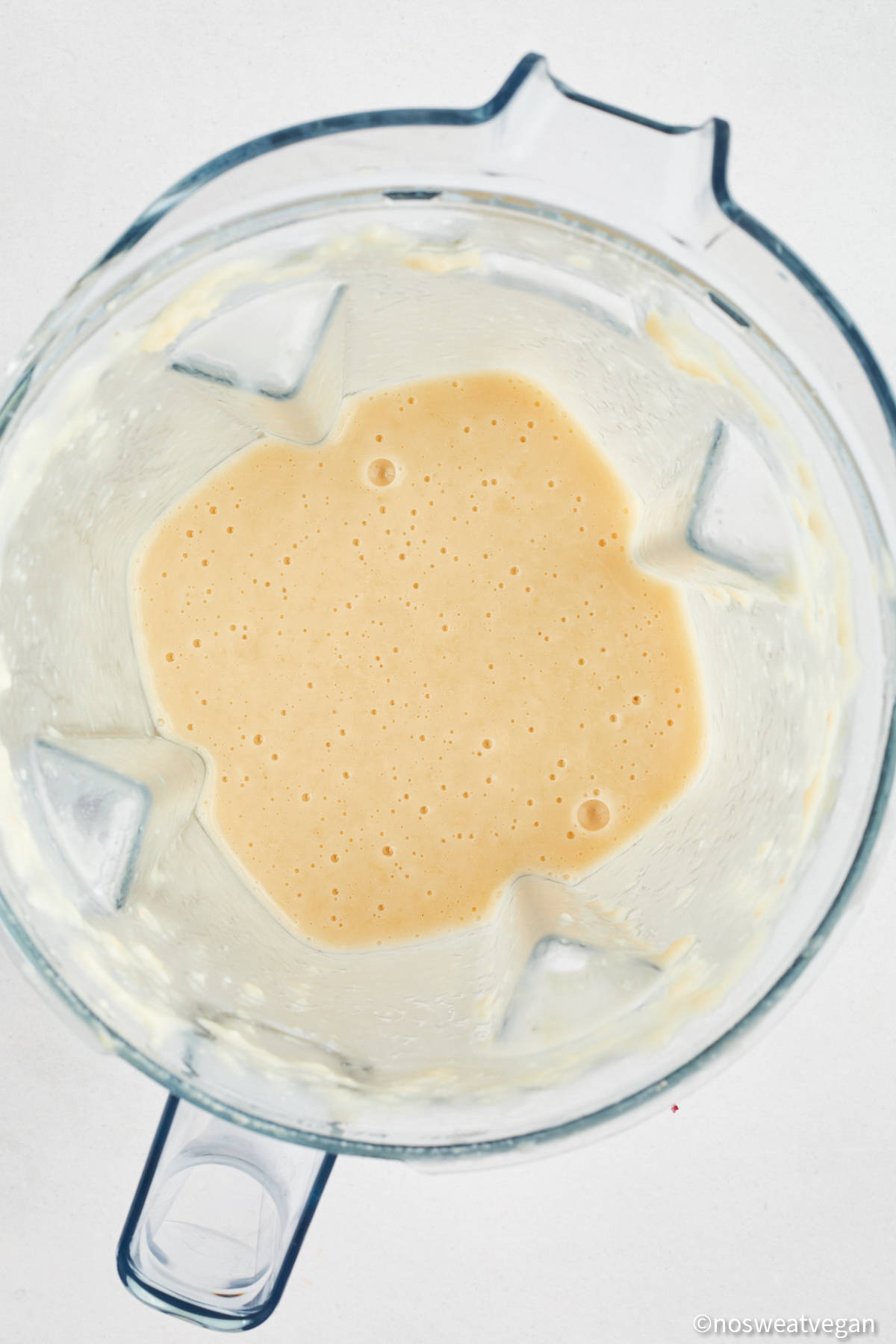Blended white beans and veggie broth in a blender.