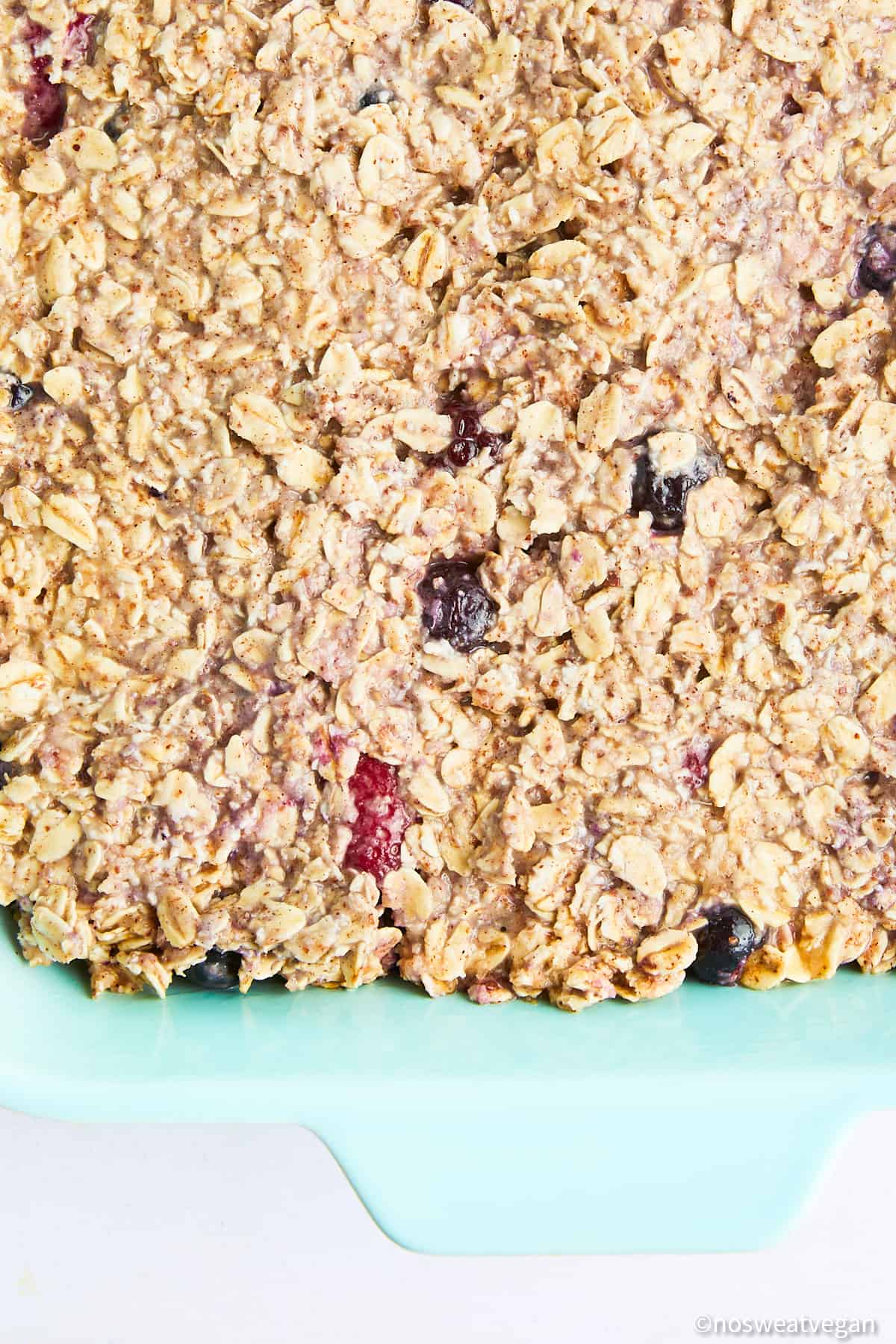 Uncooked oatmeal mixture in a baking dish.