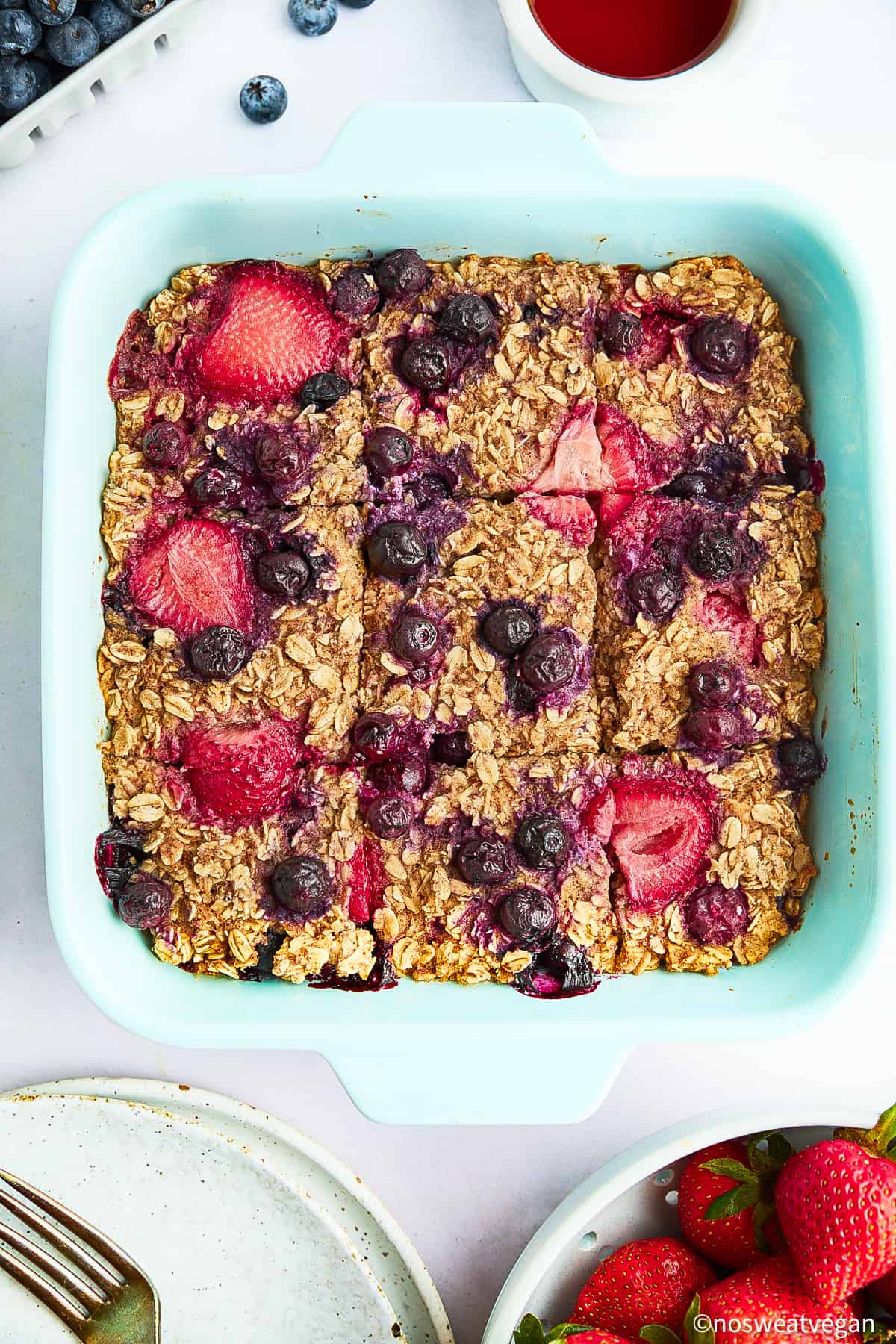 Vegan baked oats cut into squares in a baking dish.