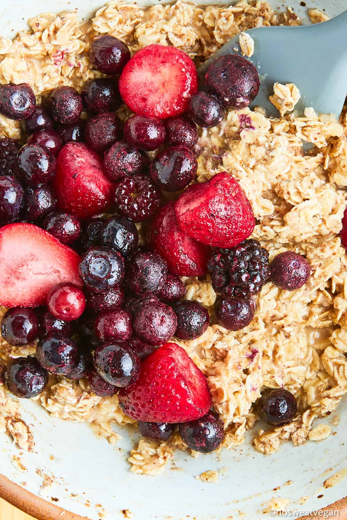 Berries added to the oatmeal mixture.