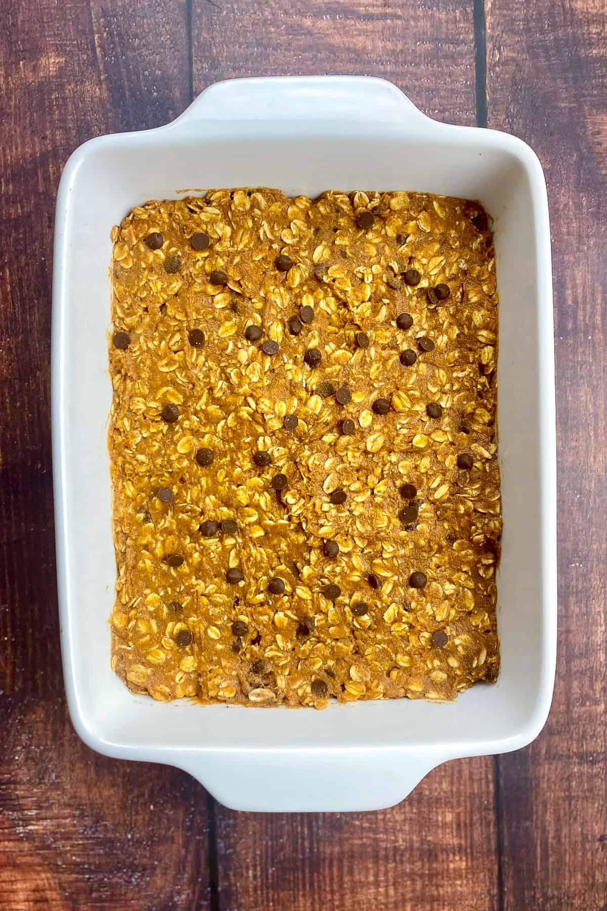 Pumpkin baked oats uncooked in a baking dish.