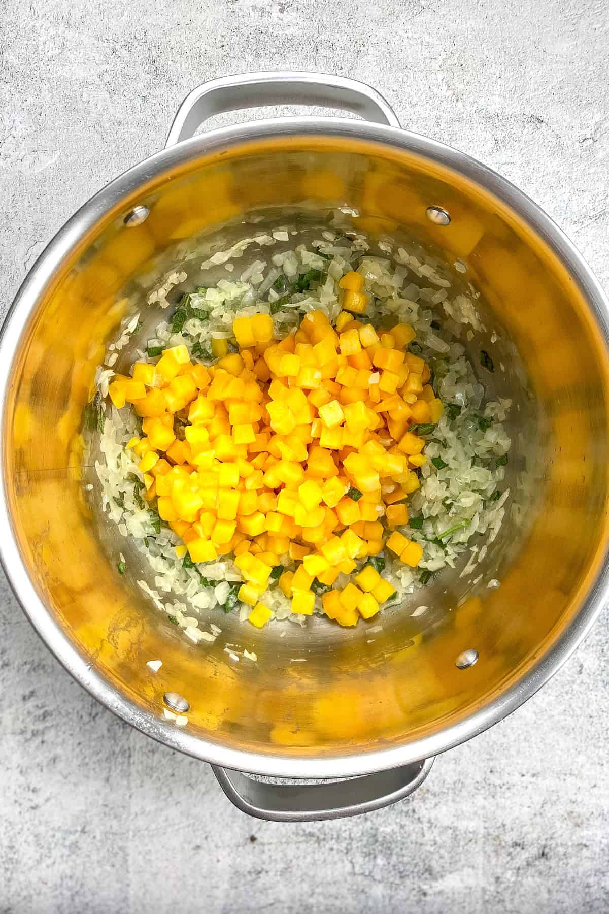 Pumpkin cubes added to pot.