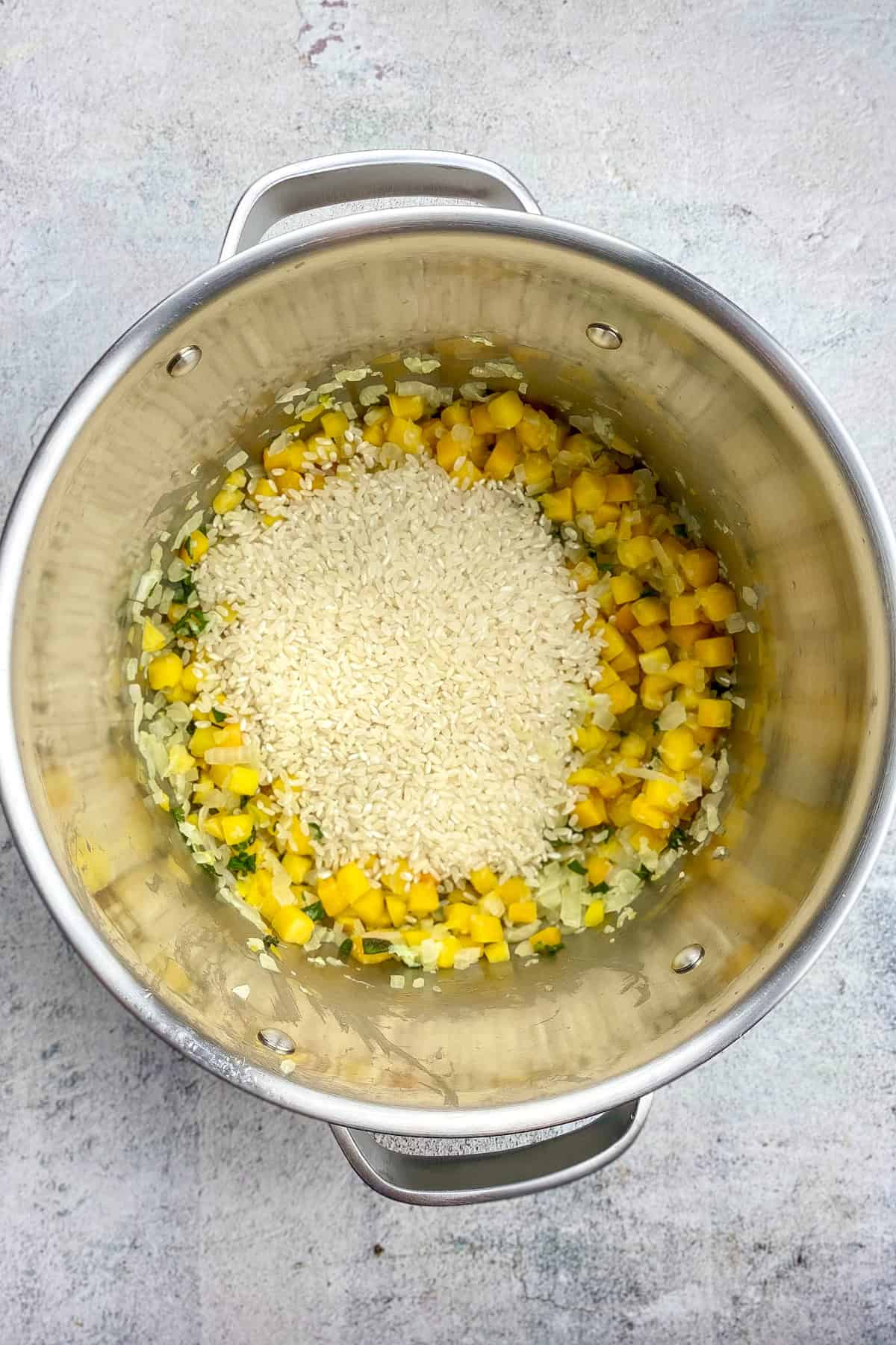Arborio rice added to the pot.