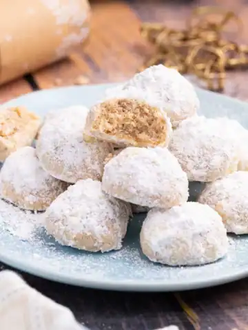 Vegan snowball cookies on a plate.