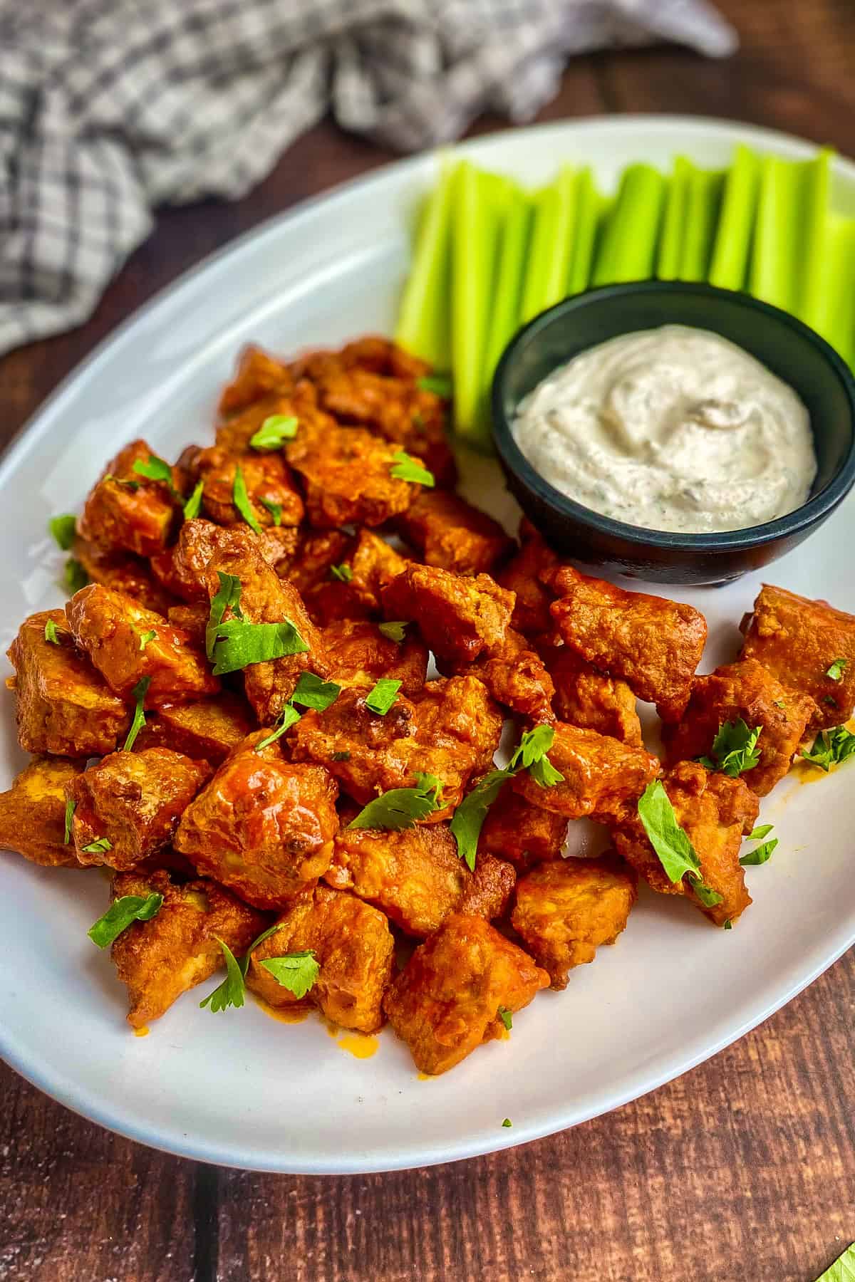 Vegan buffalo wings on a plate.